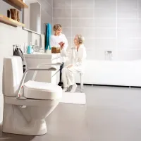 Etac Hi-Loo Toilet Seat in bathroom with Mum