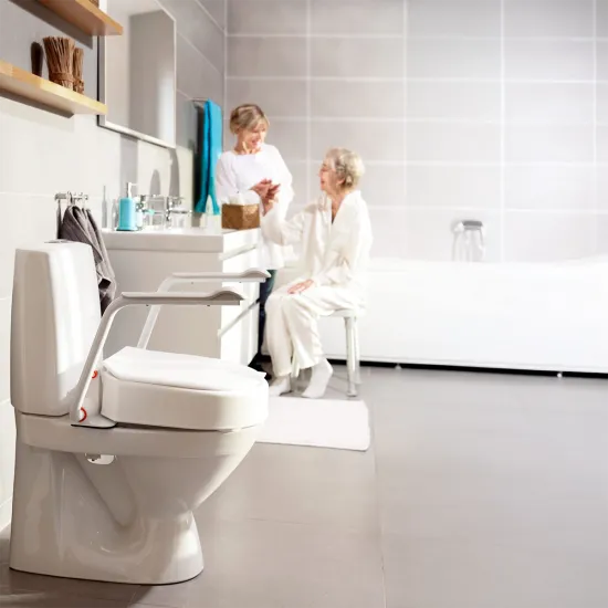 Etac Hi-Loo Toilet Seat in bathroom with Mum