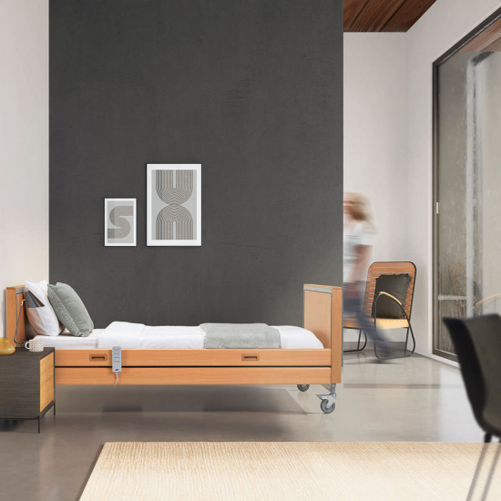 Invacare Medley Ergo Profiling Bed with Side Rails in room