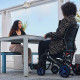 Quickie Q50R Carbon Folding Powered Wheelchair meeting friends