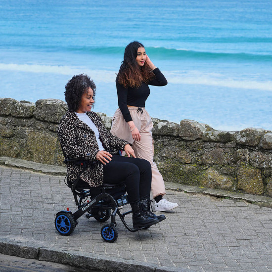 Quickie Q50R Carbon Folding Powered Wheelchair with friends