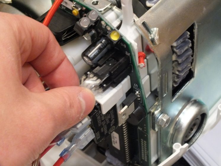 Engineer carrying out a LOLER inspection on a hoist mechanism